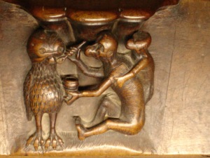 Mono dando de comer a la lechuza. (Catedral de Toledo, detalle Coro)